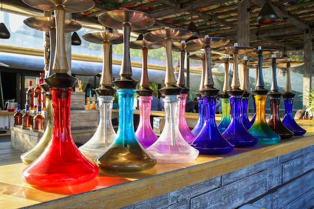 hookahs made of colored glass on the bar