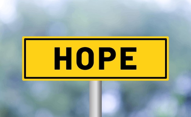 Hope road sign on blur background