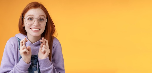 Hopeful young cute silly dreamy redhead attractive girl ginger straight haircut wearing glasses