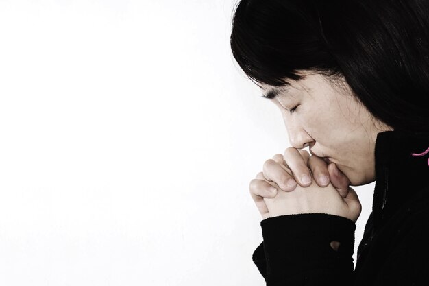 hopeless woman praying on white