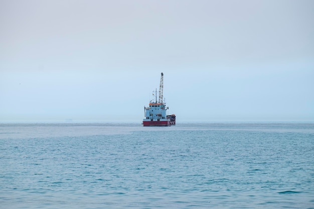 Hopper dredger vessel in the sea