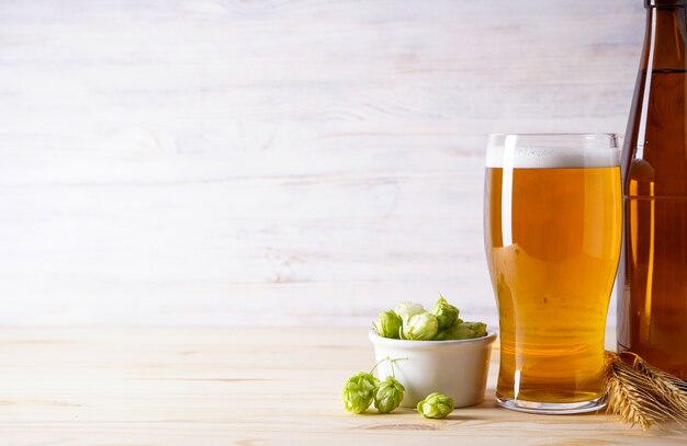 Hops and light beer on table