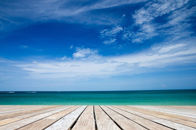 Horizon line with wooden pier over sea and sky