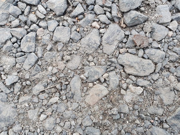 Horizontal asphalt background with stones