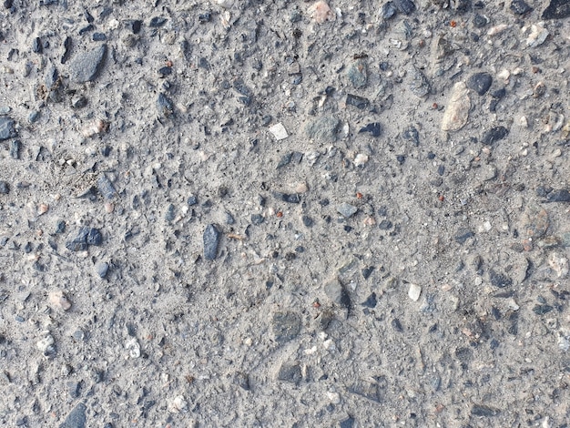 Horizontal asphalt background with stones