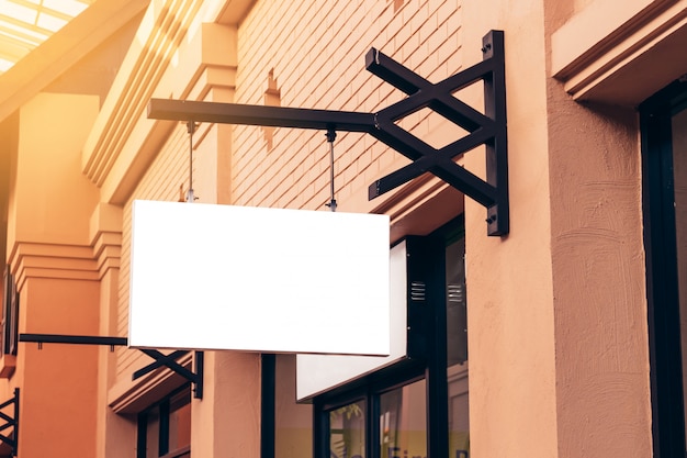 Photo horizontal black empty signage on clothes shop front with copy space.