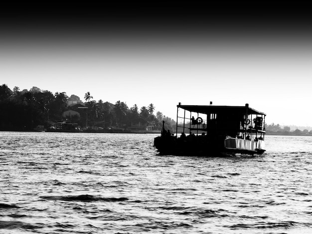 Horizontal black and white indian ferry landscape silhouette backdrop