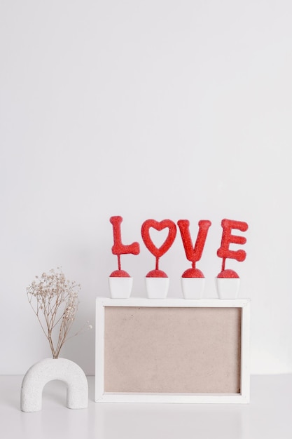 Photo horizontal frame mockup with love pot in neutral minimalist interior with dried babybreath flower