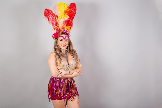 Horizontal half body shot beautiful Brazilian woman in carnival clothes smiling