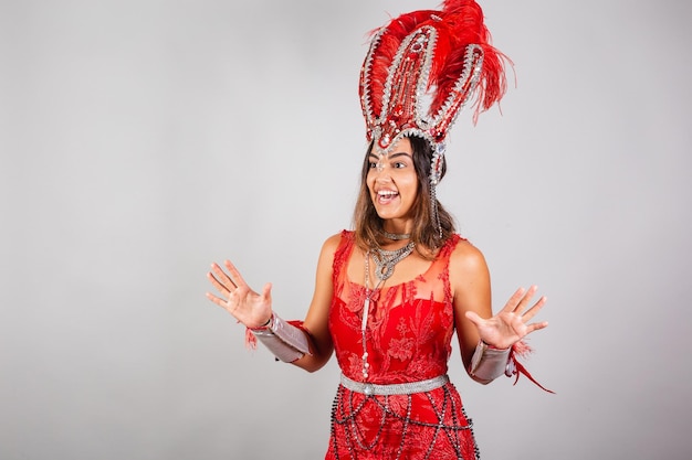 Horizontal half body shot beautiful Brazilian woman in carnival clothes surprise