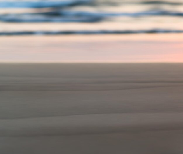 Sfondo di sfocatura orizzontale del bokeh della spiaggia di sabbia liscia pallida orizzontale