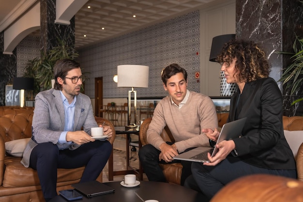 Horizontal photo of a female lawyer during a business meeting in a hotel hall