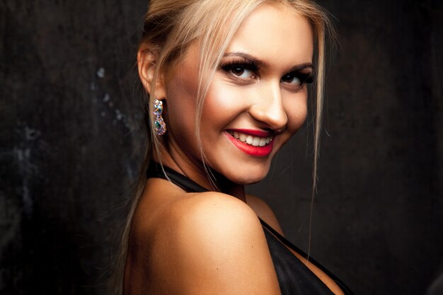 Horizontal portrait of adult blonde girl smiling