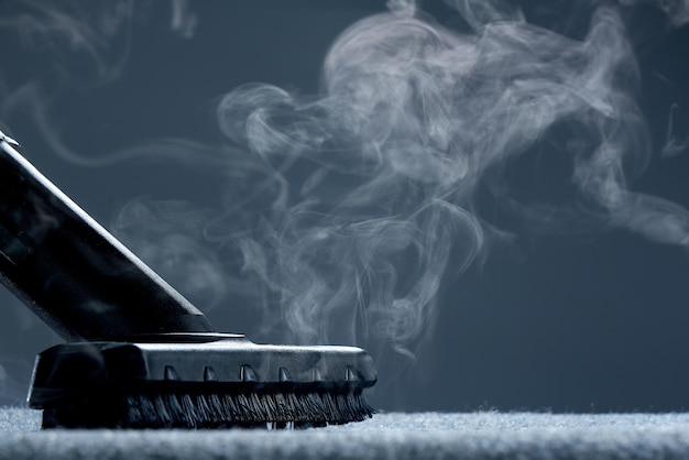 Horizontal shot of steam closeup Steam carpet cleaning on a grey background Photo with copy space