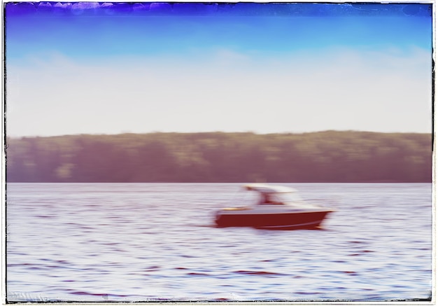 Horizontal speed boat abstraction with light leak postcard background