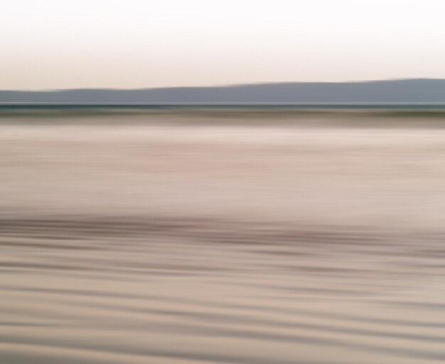 Horizontal vibrant ocean milk motion blur abstraction background backdrop