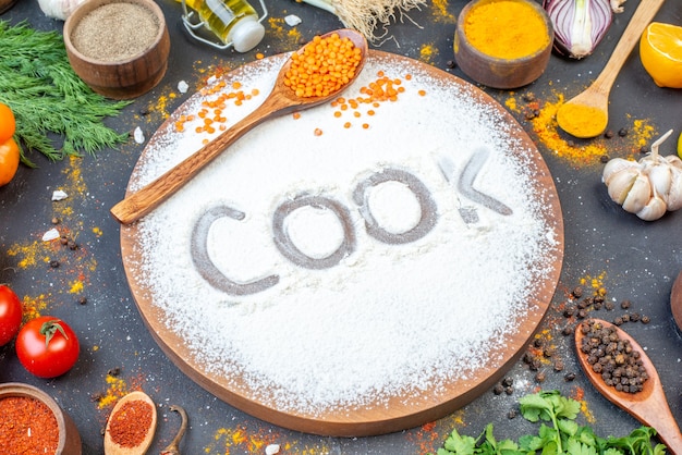 Horizontal view of cook writing with flour