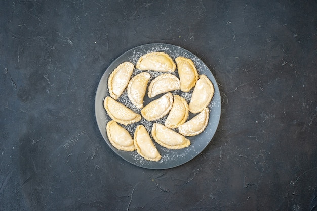 Horizontal view of homemade raw dumplings