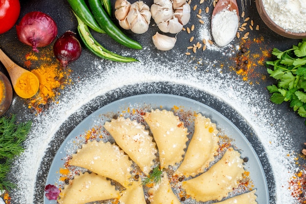 Horizontal view of raw dumplings on table