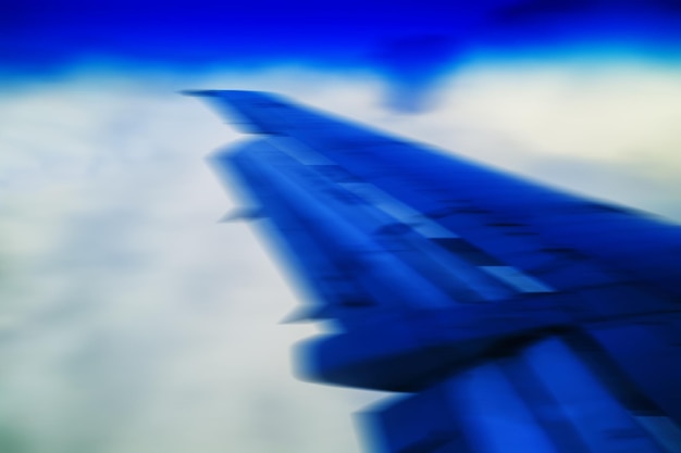 Photo horizontal vivid blue travel plane jet wing abstraction transportation background backdrop