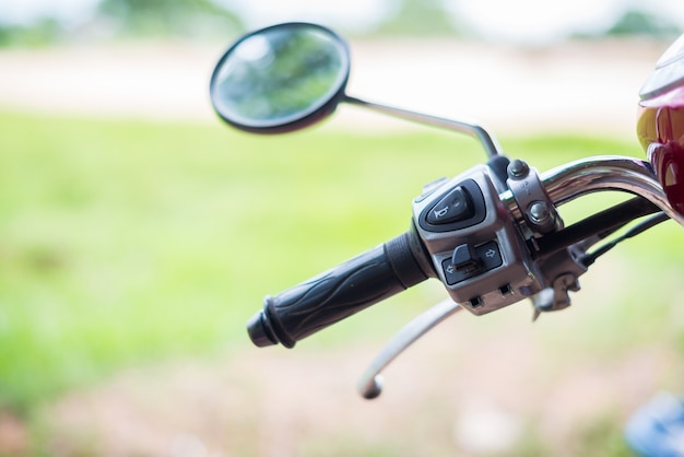 The horn button and the turn left-right button on hand the motorbike