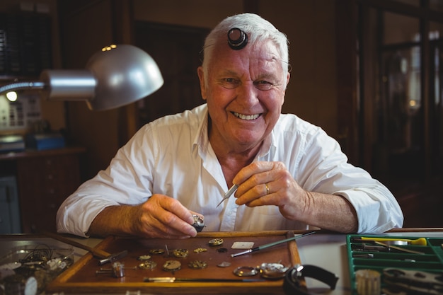 Horologist repairing a watch in the workshop