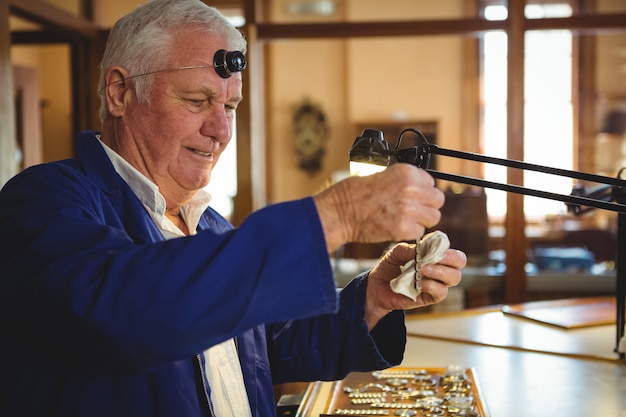 Horologist working in workshop