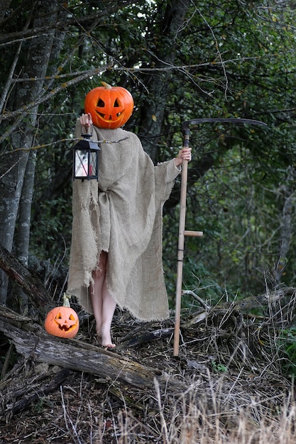 Horror pumpkin with a scythe