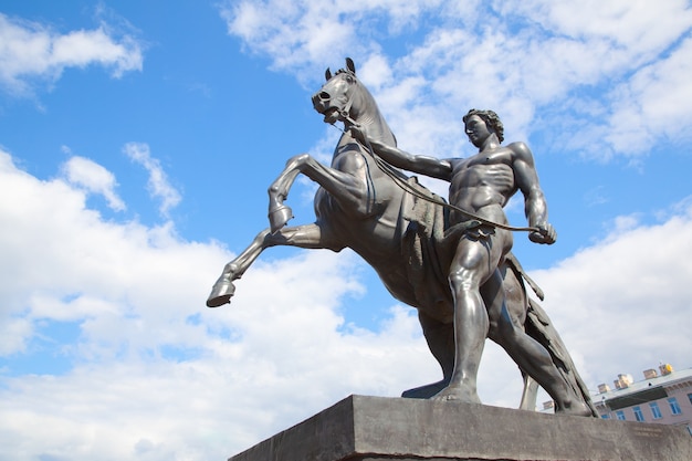 The Horse Tamers monument by Peter Klodt (1851) on Anichkov Bridge in Saint Petersburg, Russia. Landmark