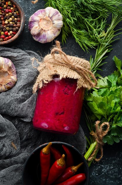 Horseradish and beetroot sauce in a glass jar. Top view.