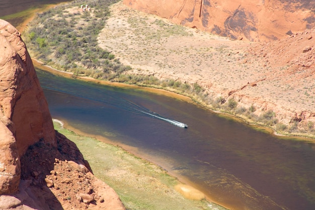 Horseshoe Bend in Arizona USA Boat driving on Colorado river