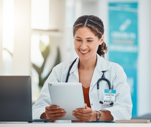 Hospital doctor and video call on tablet with happy communication online with patient in Canada Healthcare woman on internet with technology app for virtual consultation conversation in office