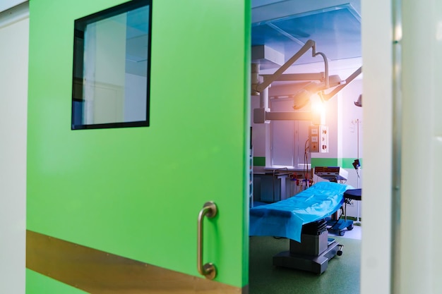 Hospital interior with operating surgery table lamps and ultra modern devices technology in modern clinic