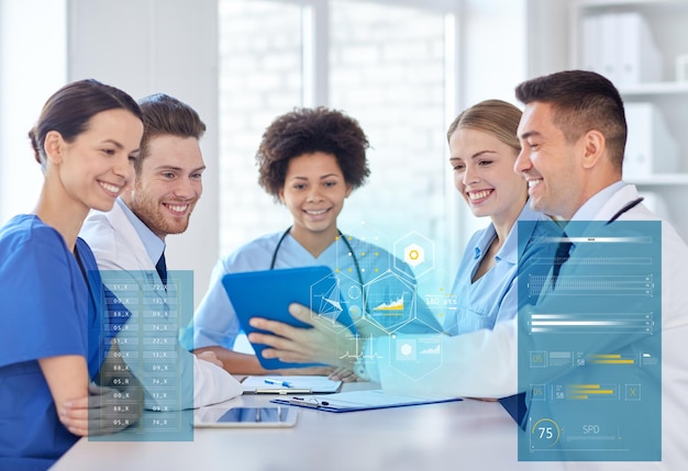 hospital, profession, people and medicine concept - group of happy doctors with tablet pc computers meeting at medical office