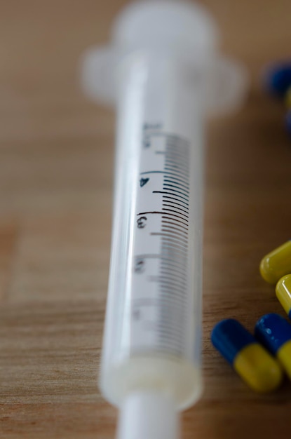 Photo hospital syringe with selective focus on measuring the 3 milliliters