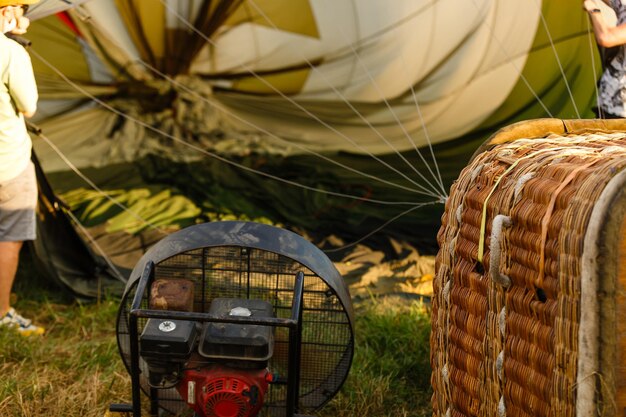 Hot air balloon basket on grass background. This has clipping path.