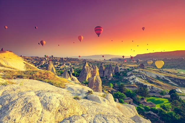 Hot air balloon flying over a field