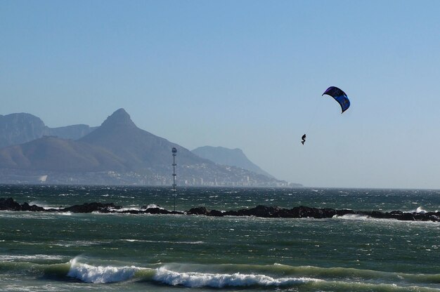 Hot air balloon flying over sea