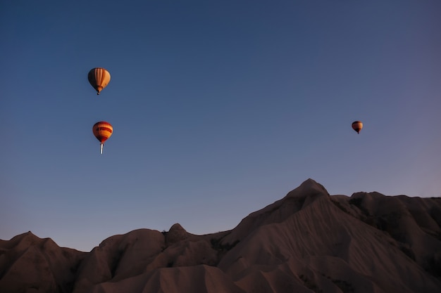 Hot air balloon parade in cappadocia at sunrise