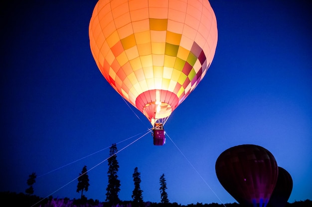 Hot air balloons flying at night