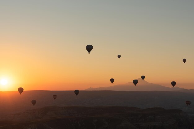 Hot air balloons in the sky during sunrise Travel dreams come true concept