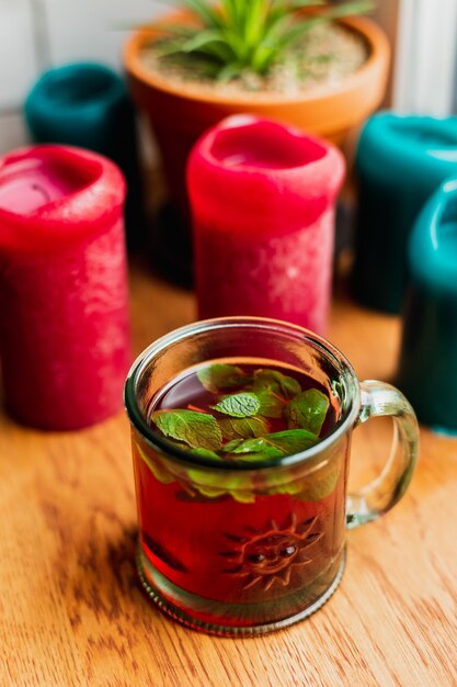 hot alcoholic drink with mint in a glass mug