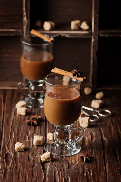 Hot american coffee with cinnamon on the vintage table