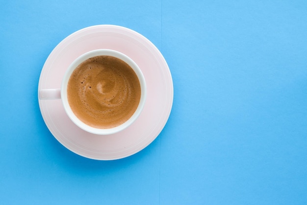 Hot aromatic coffee on blue background flatlay