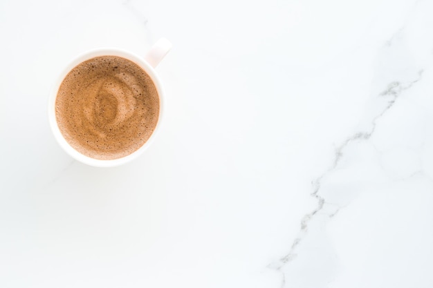 Hot aromatic coffee on marble flatlay