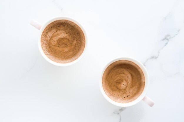 Hot aromatic coffee on marble flatlay