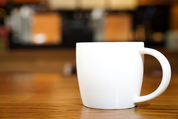 Hot Art Latte in the White art on the wood table