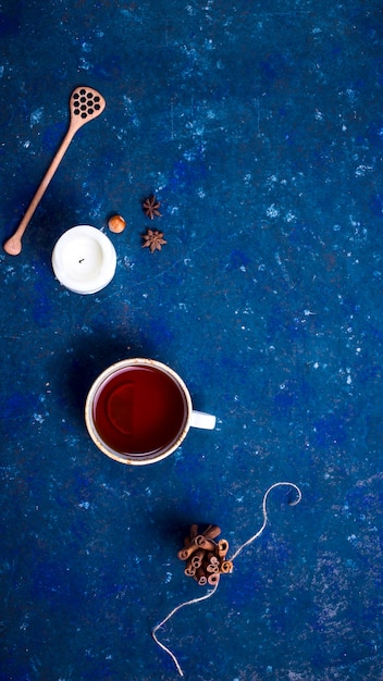 Hot autumn drink on a dark blue