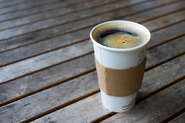 hot black coffee on wooden table