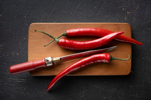 Hot Chili pepper pods on a cutting board